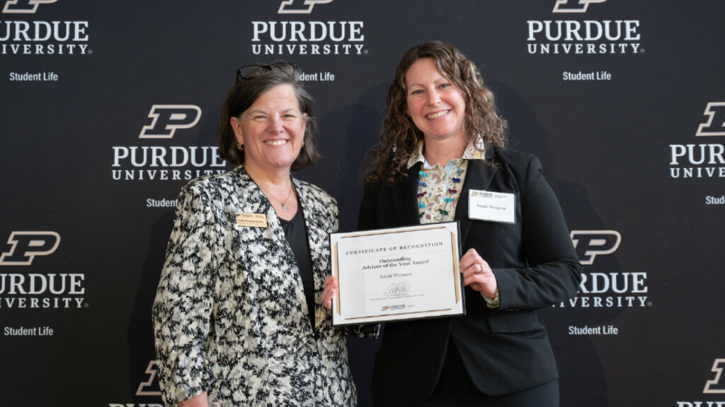 Purdue Senior Associate Vice Provost & Dean of Students Katie Sermersheim (left) presented the Outstanding Advisor of the Year Award to Dr. Sarah Waxman at the Student Life Honors Awards ceremony.